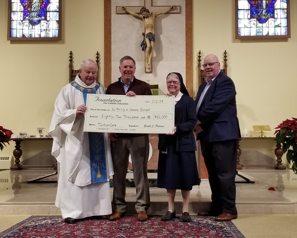 SSPJ Parish School Receives Check from TuitionCare for 20232024 School